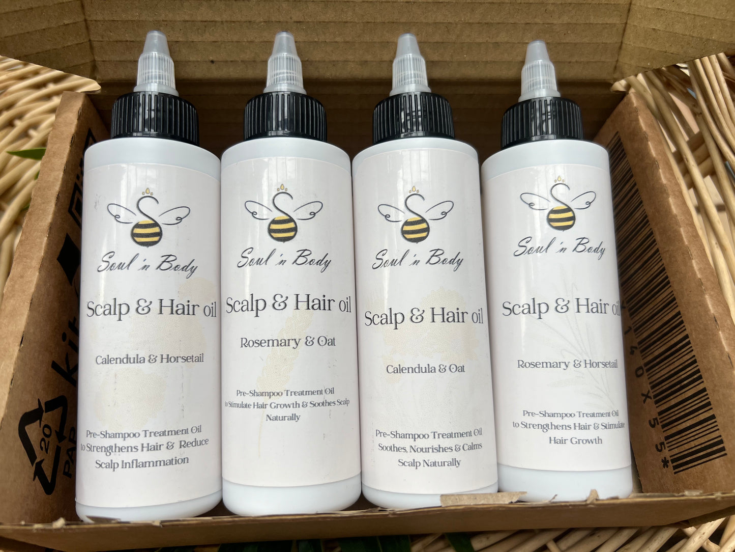 Handmade pre-shampoo scalp and hair oil in eco-friendly packaging, natural hair care product