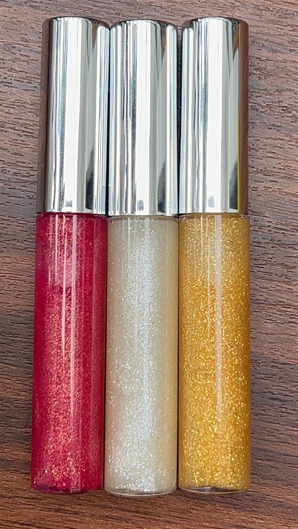 three glitter handmade lip gloss red, white and golden glitter