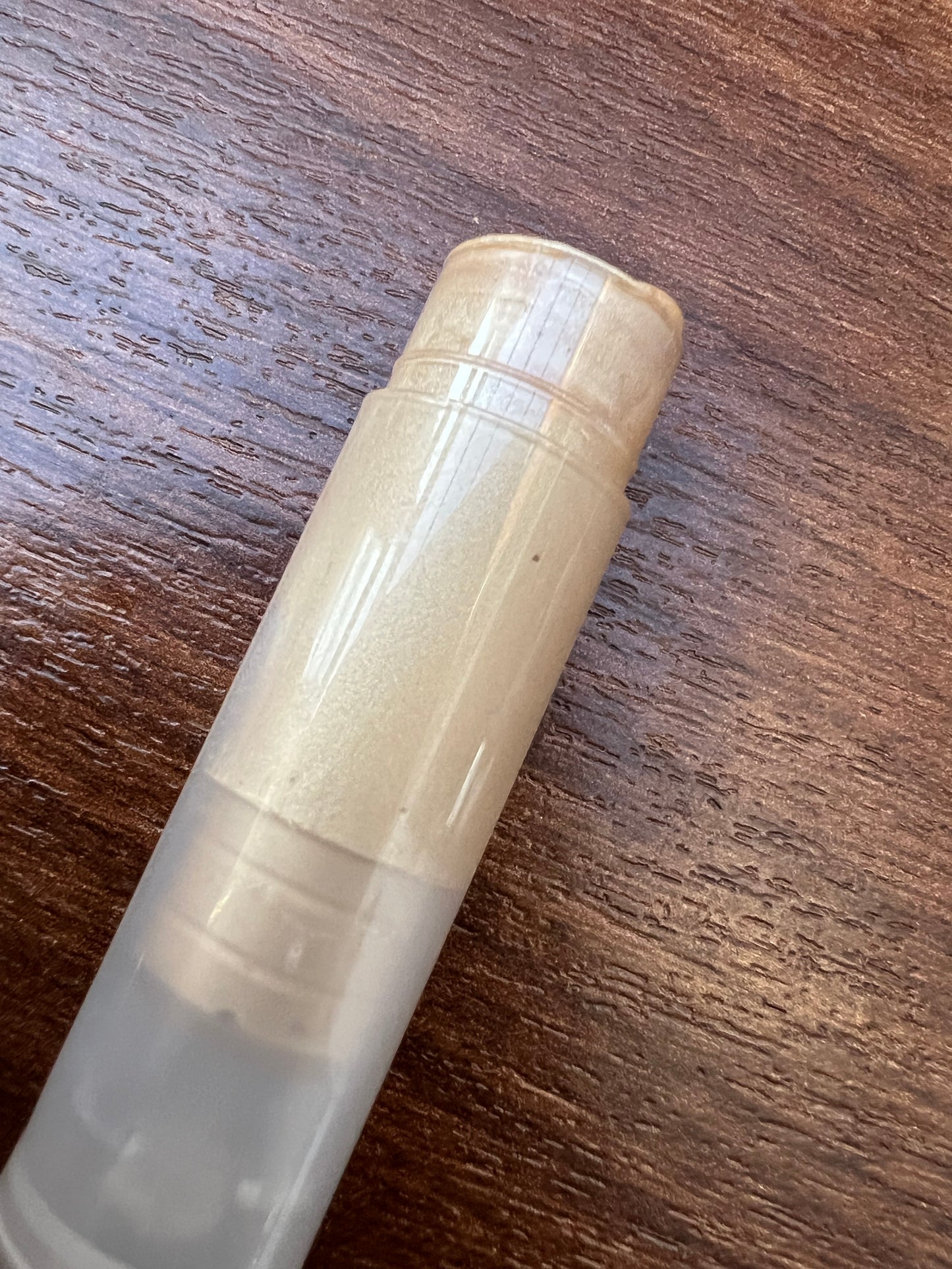 Golden Hour limited edition handmade lip balm in clear twist-up tube showing warm golden tint – natural moisturising lip care by Soul n Body