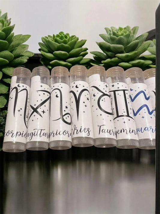 Row of astrology-inspired lip balms with custom zodiac labels