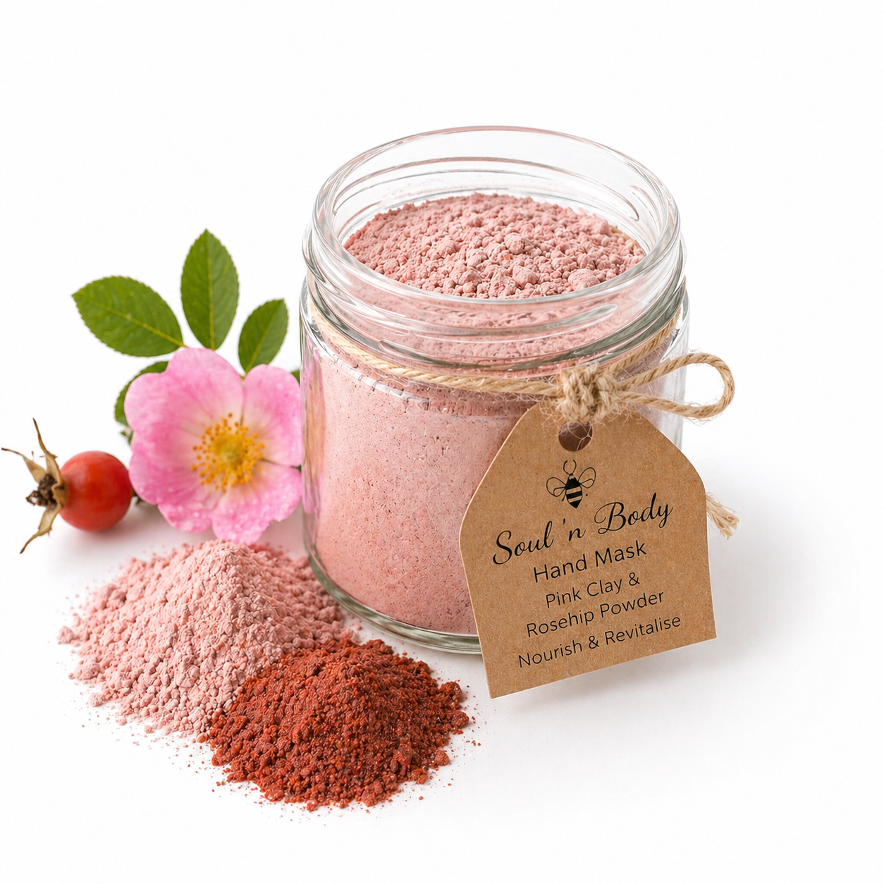 Glass jar of pink powder with a tag labeled 'Soul n Body' on a white background with flowers.