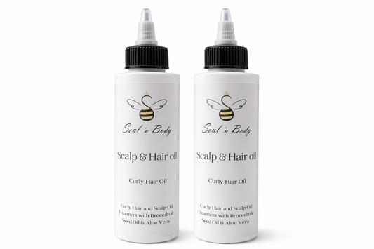 Two bottles of Scalp and Hair Oil Soul n Body on a white background
