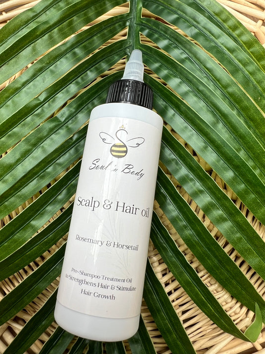 Bottle of Scalp & Hair oil on a leaf with 'Soul n Body' branding