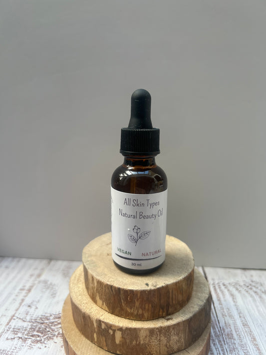 Bottle of 'All Skin Types Natural Beauty Oil' on a wooden stand with a plain background