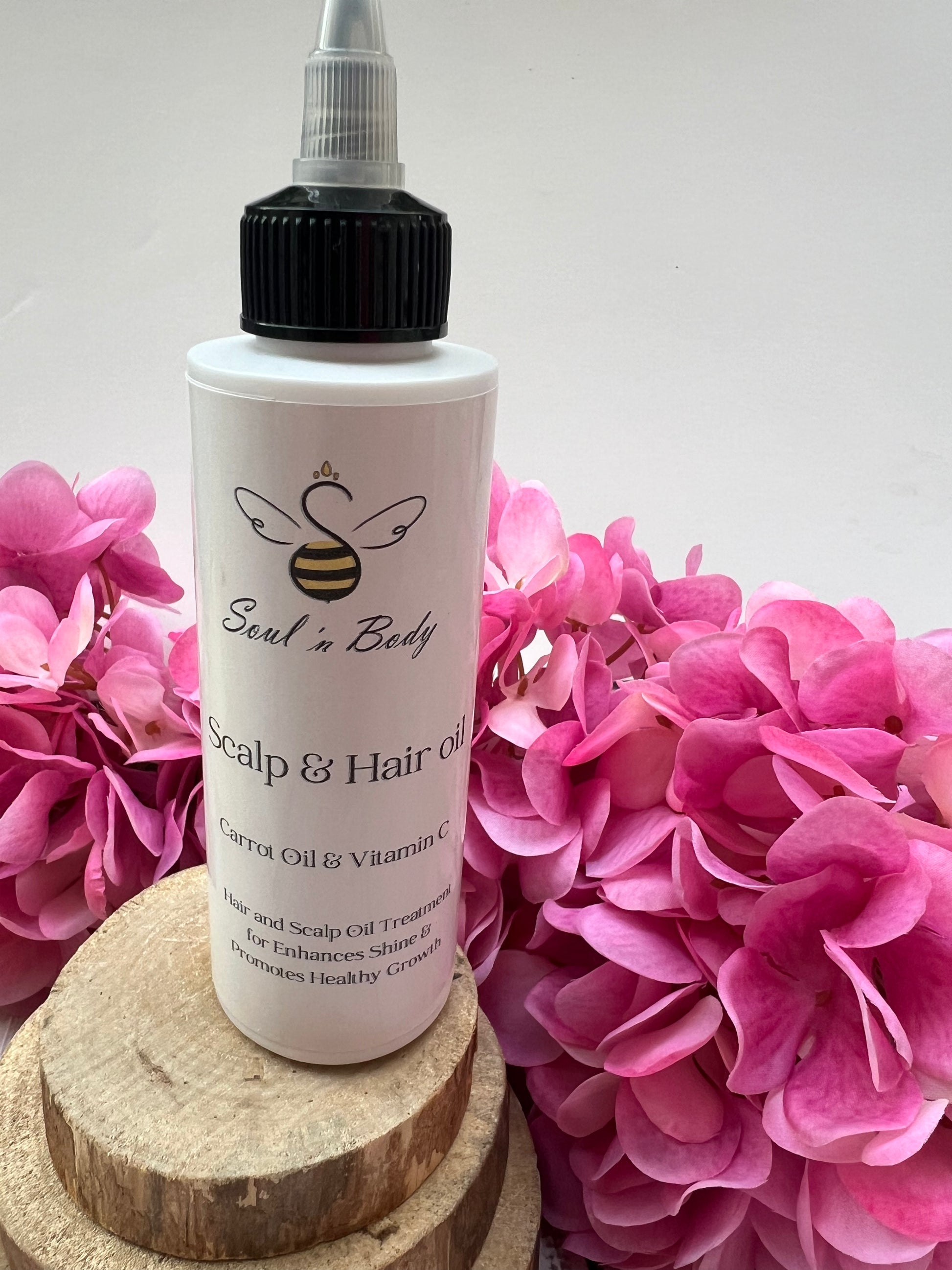 Natural shine-enhancing hair oil in plastic bottle – perfect for dry hair