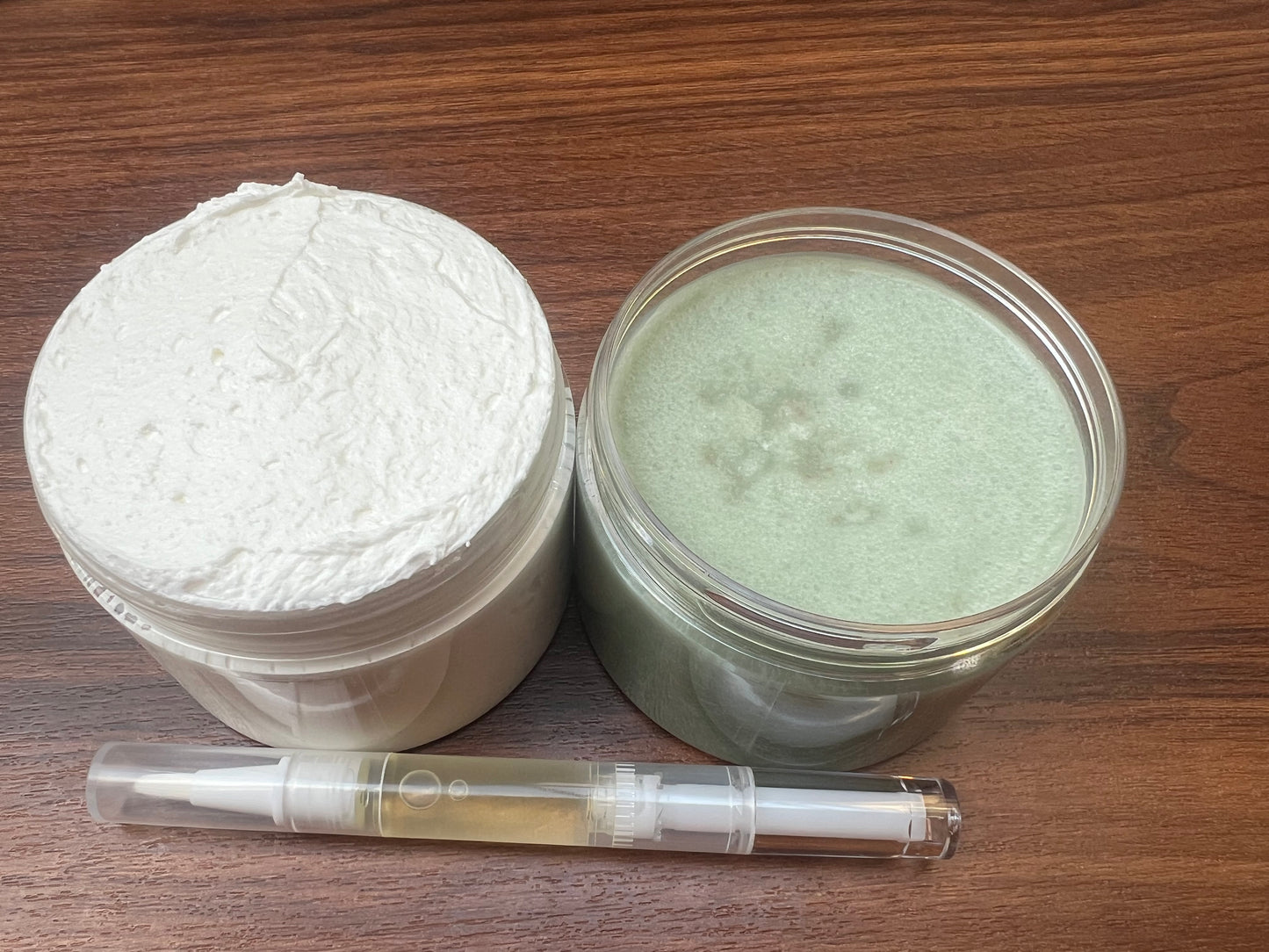 a set of whipped foot butter, foot scrub ad nail oil