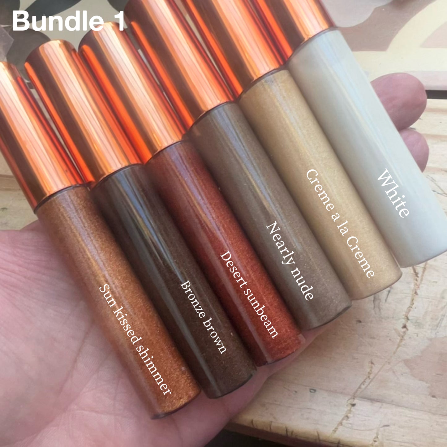 Bundle of 5 handmade natural lip glosses – Sun Kissed Shimmer, Bronze Brown, Desert Sunbeam, Nearly Nude, Crème à la Crème, and White – moisturizing, glossy finish.